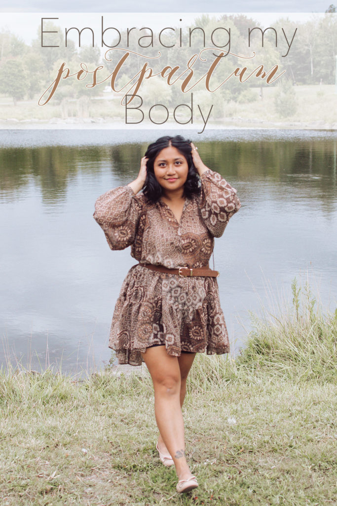 Canadian lifestyle blogger, Lisa Favre, wearing a light brown dress, in front of a small pond on a cloudy day.