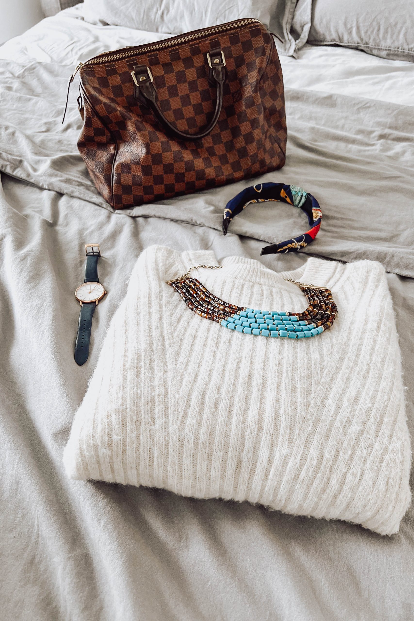 Statement necklace on a white sweater