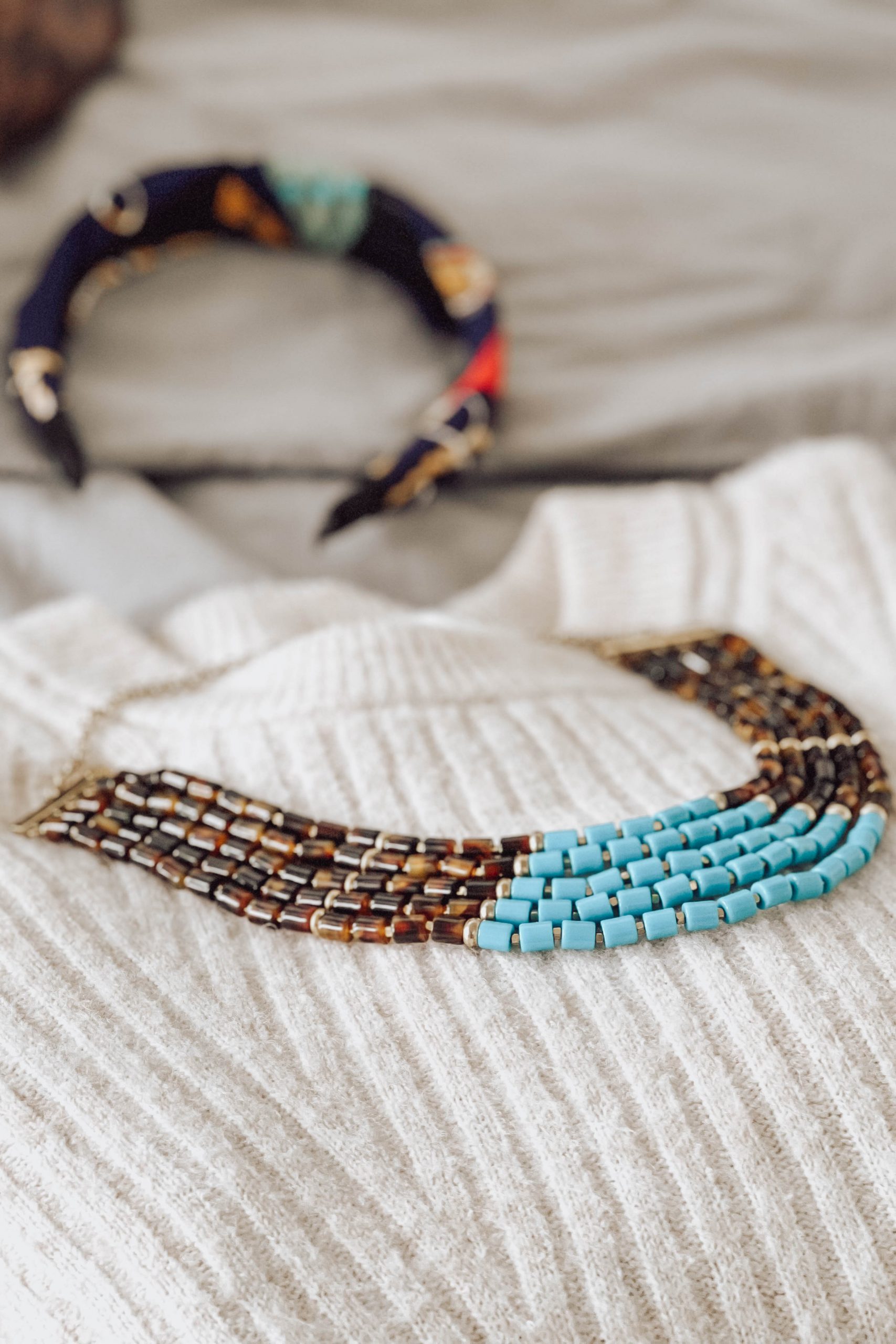 Statement necklace on a white sweater