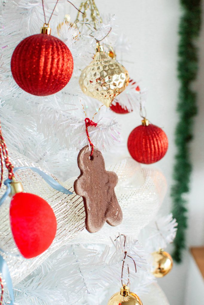 Make your very own gingerbread cookies ornaments with an easy-to-follow cinnamon salt dough recipe that will make your home smell cozy and warm for the holiday season.