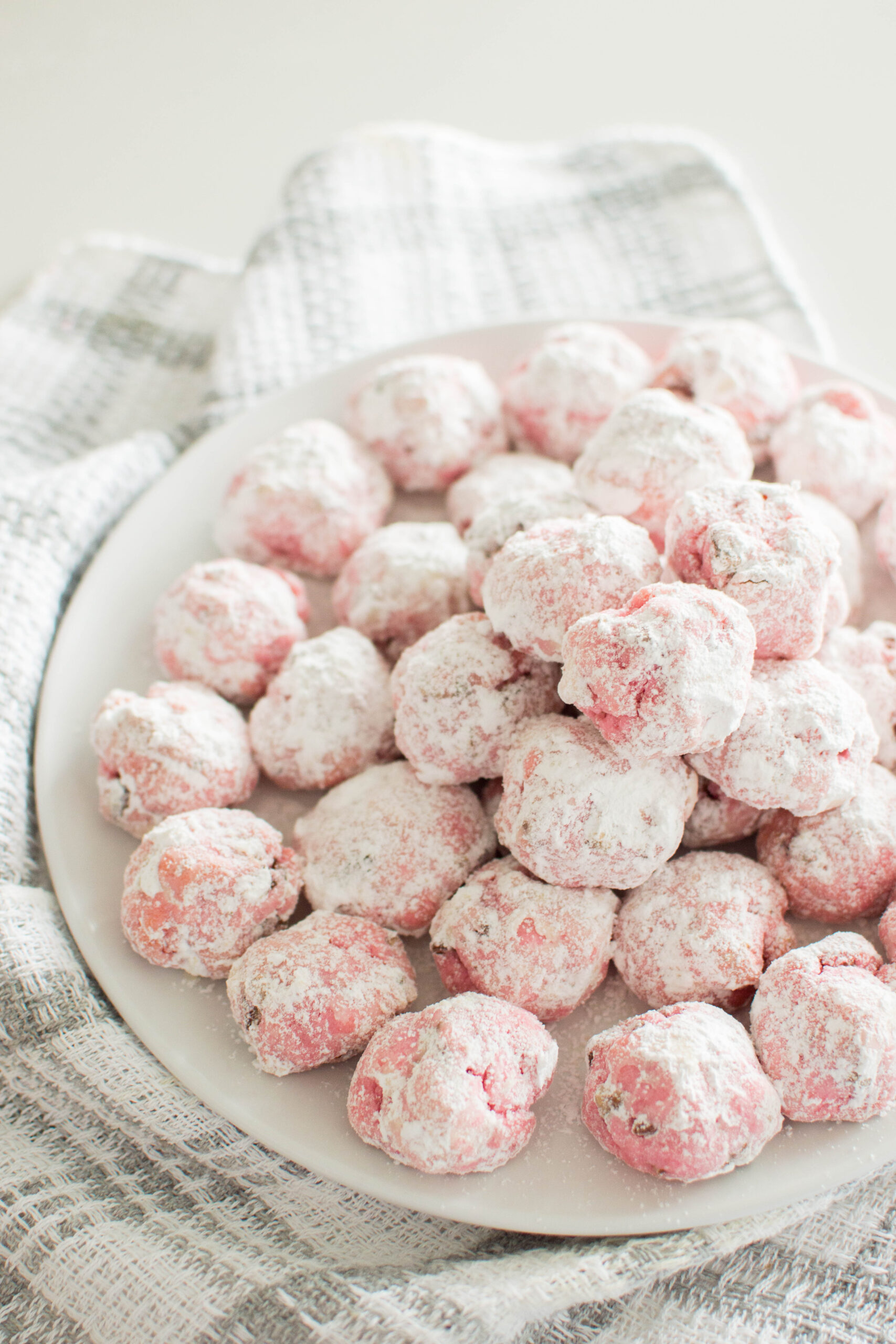 Give your favorite Snowball Cookies a Valentine’s Day makeover with this fun and easy recipe! These bite-sized cookies are buttery, nutty, and coated in powdered sugar, all dressed up in pink for the season of love. Perfect for gifting or sharing!
