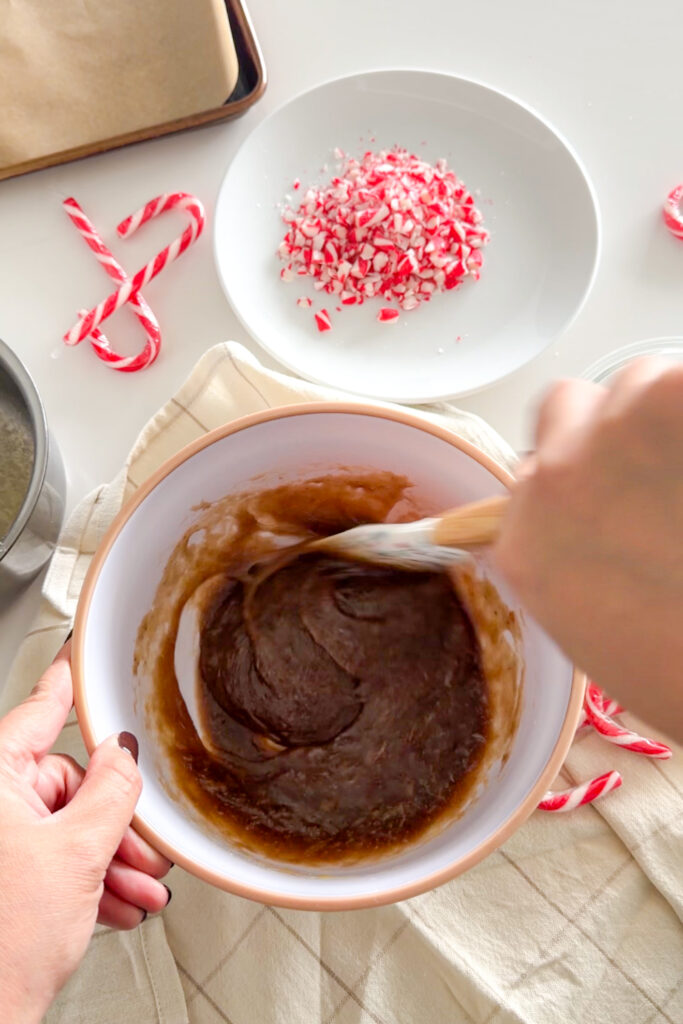 Mixing wet ingredients for peppermint mocha crinkle cookies