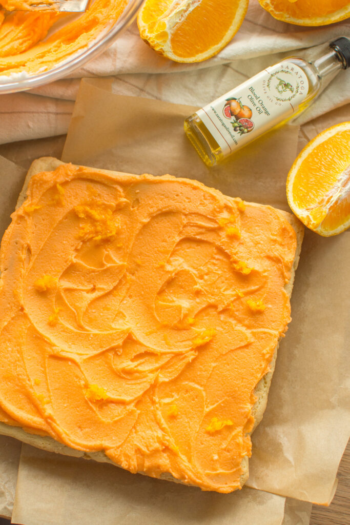 Orange cookie bars before being cut into